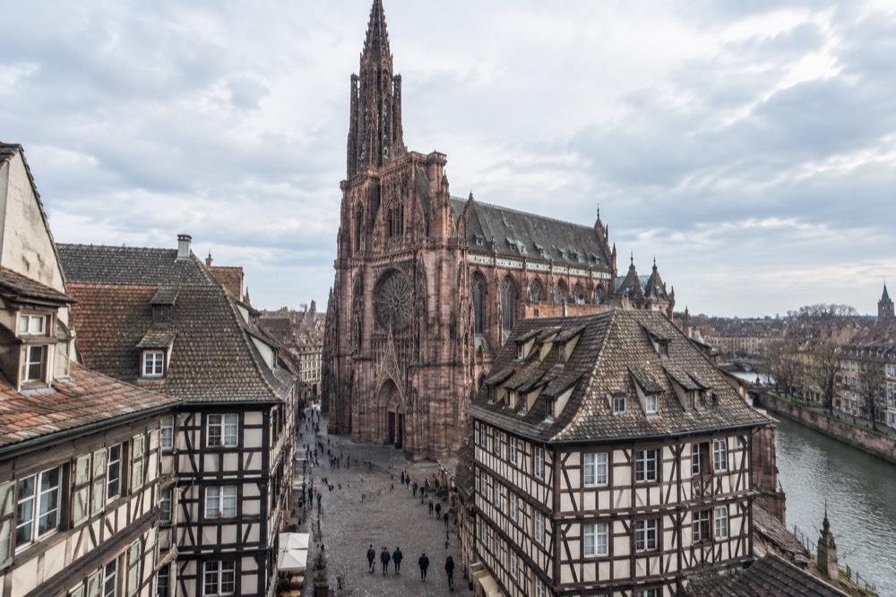 Street signs and half-timbered facades on a lane in Strasbourg's old town