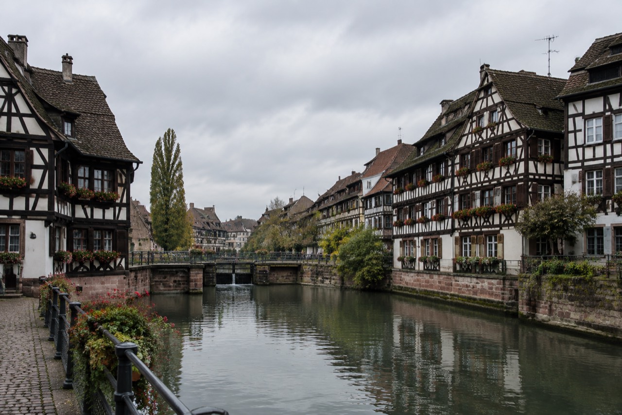 Half-timbered houses along a canal in Strasbourg's Petite France quarter on a quiet morning