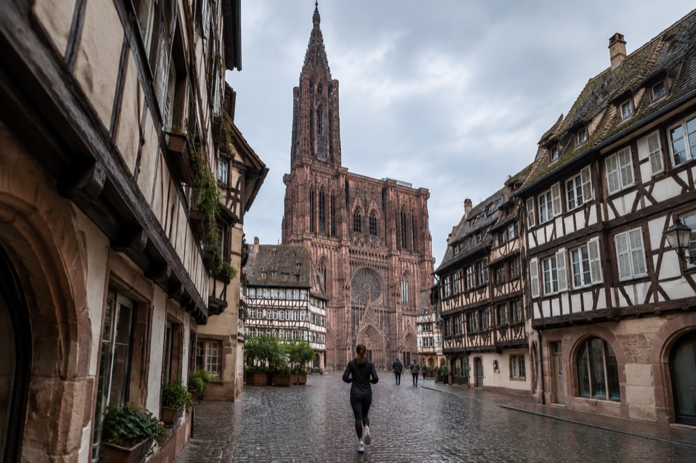 The single spire and west front of Strasbourg Cathedral rising above the old city rooftops