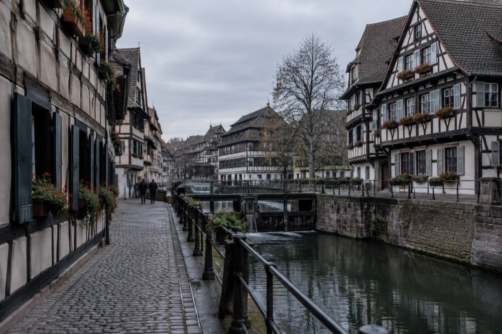 A quiet lane of half-timbered houses in Petite France, Strasbourg, in early morning light