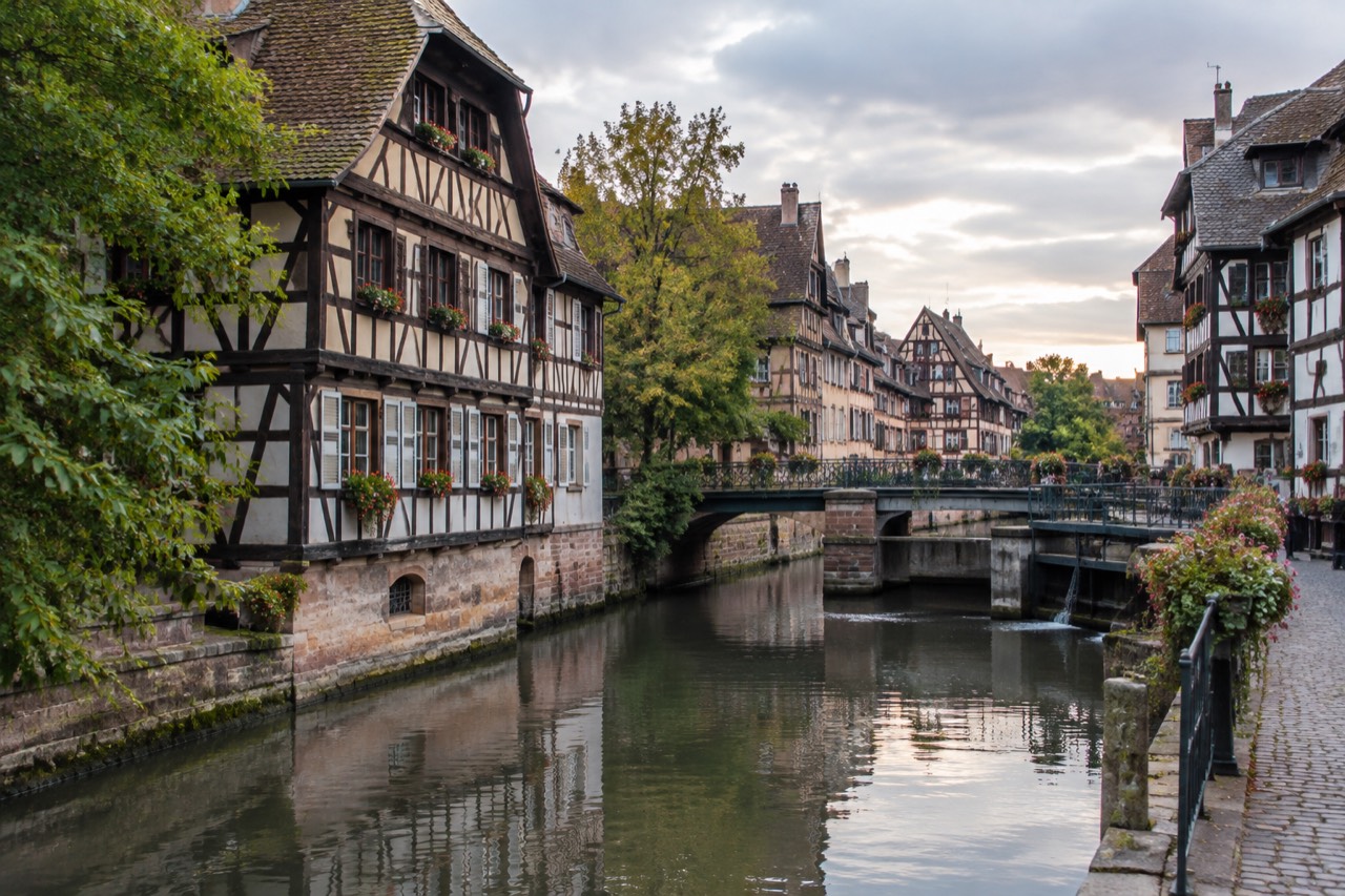 Half-timbered houses and a canal bridge in Petite France, Strasbourg, at dusk
