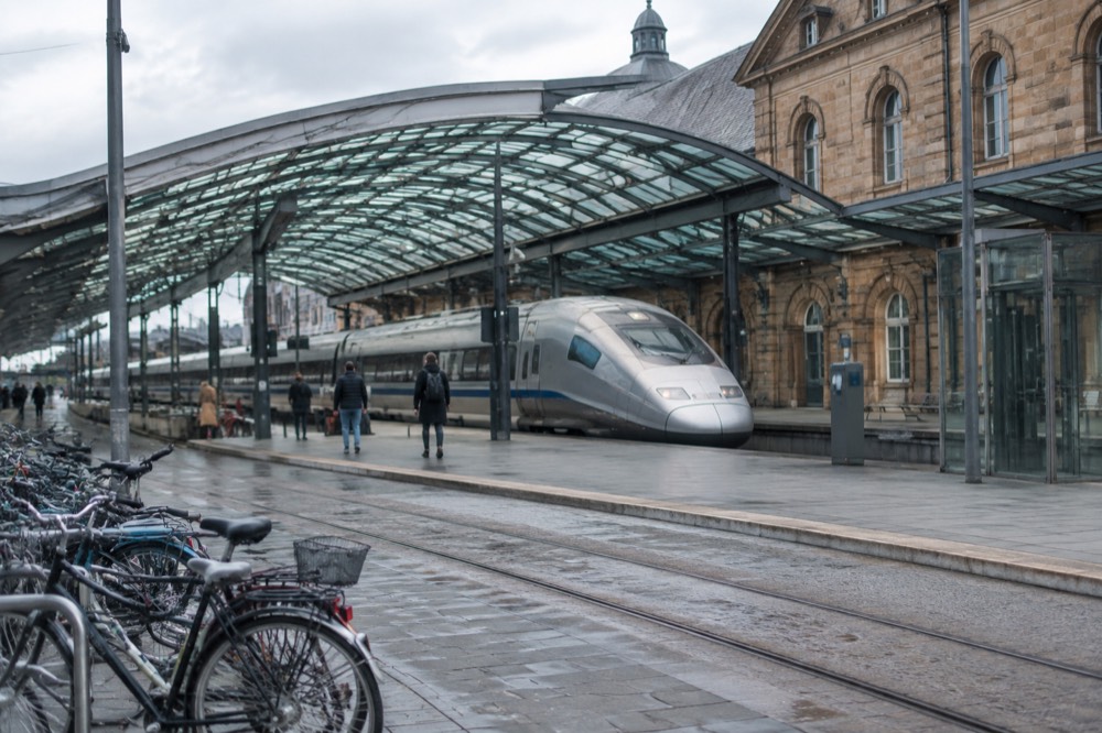 A high-speed train standing at a platform in a French railway station