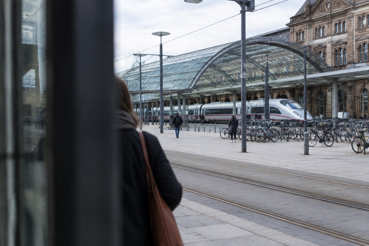 A high-speed train standing at a platform in a French railway station