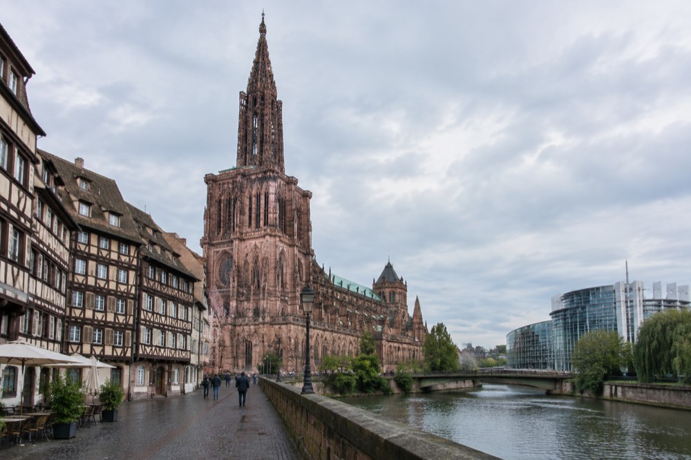 Modern glass and steel European institution buildings beside the River Ill in Strasbourg