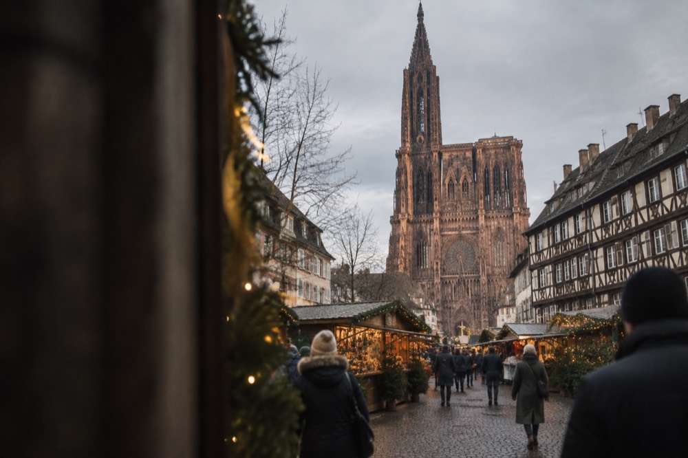 Christmas market stalls and lights in a square of the Strasbourg Old Town