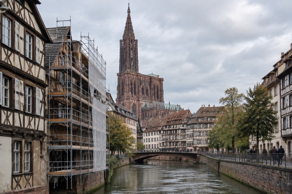 Scaffolded timber building beside the Ill river in central Strasbourg