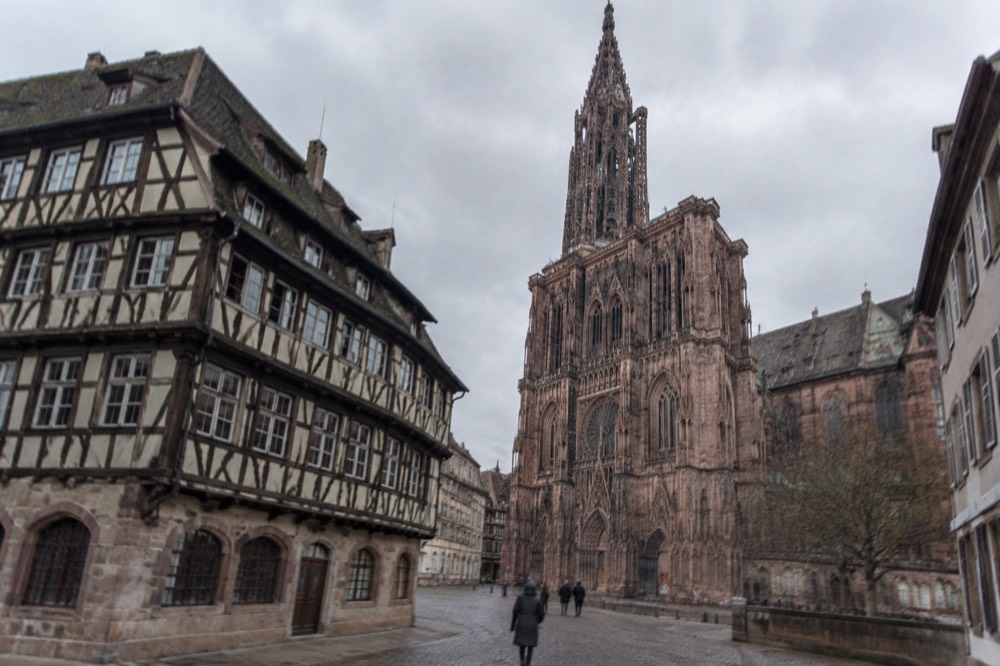 Half-timbered museum building beside Strasbourg Cathedral on a quiet morning