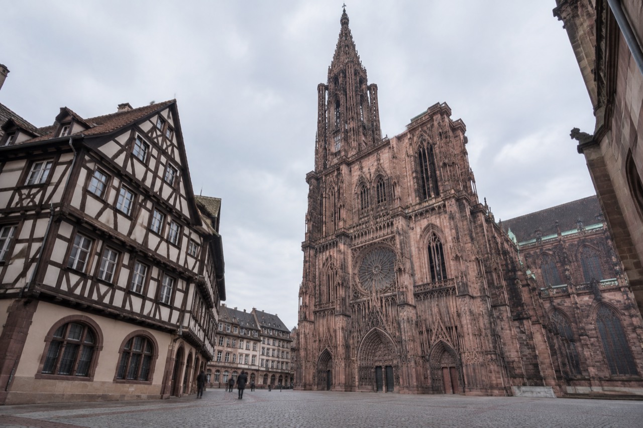 Half-timbered museum building beside Strasbourg Cathedral on a quiet morning