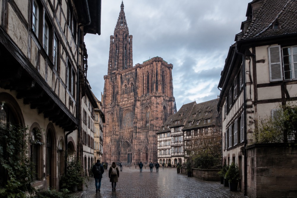 Stone Gothic cathedral façade rising above rooftops in central Strasbourg