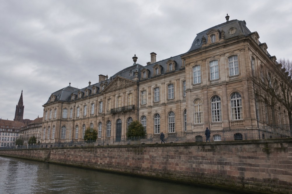 The long stone facade of Palais Rohan seen from the cathedral square in Strasbourg