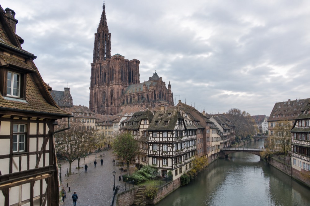 Half-timbered houses along a river channel near the palace in Strasbourg