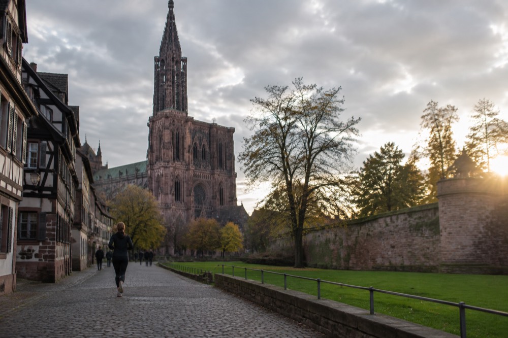 Evening light over lawns and old fortress walls in a Strasbourg park