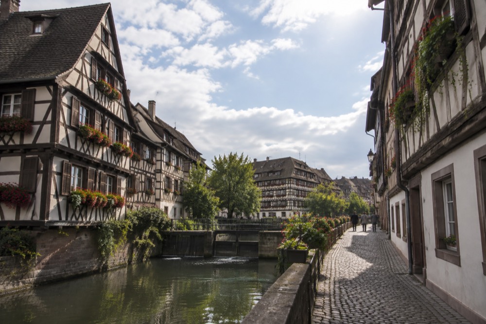 A quiet cobbled lane of half-timbered houses in Petite France, Strasbourg, in morning light
