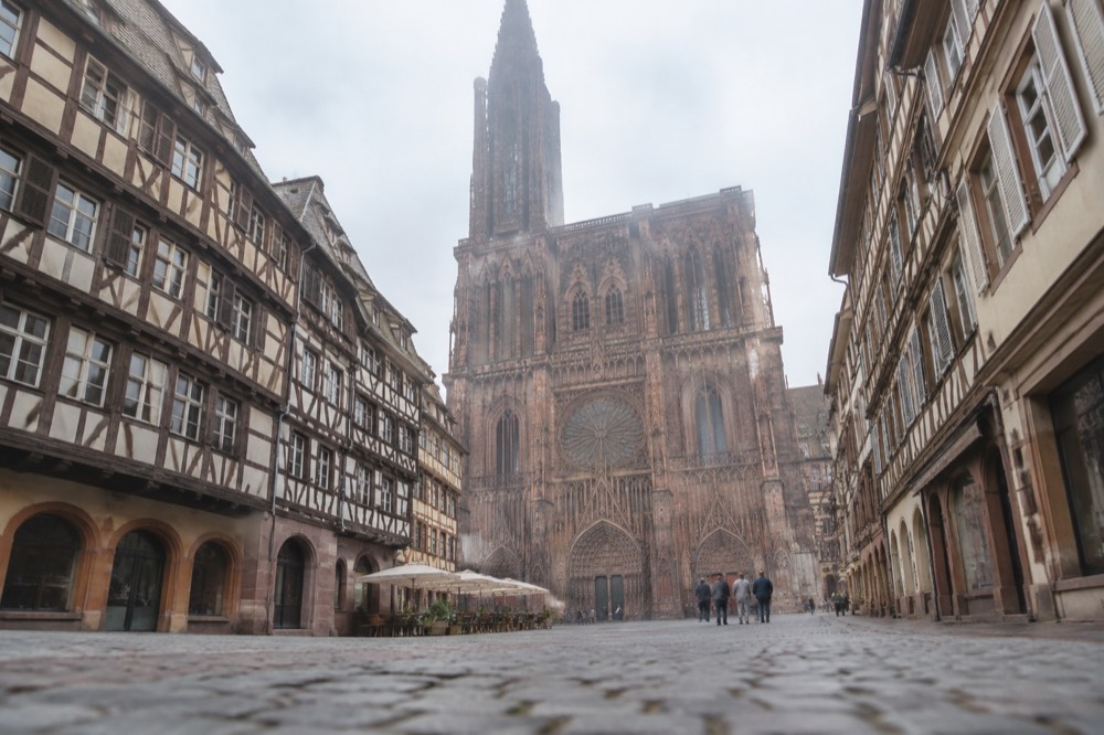 The west front of Strasbourg Cathedral seen from a square in the old town