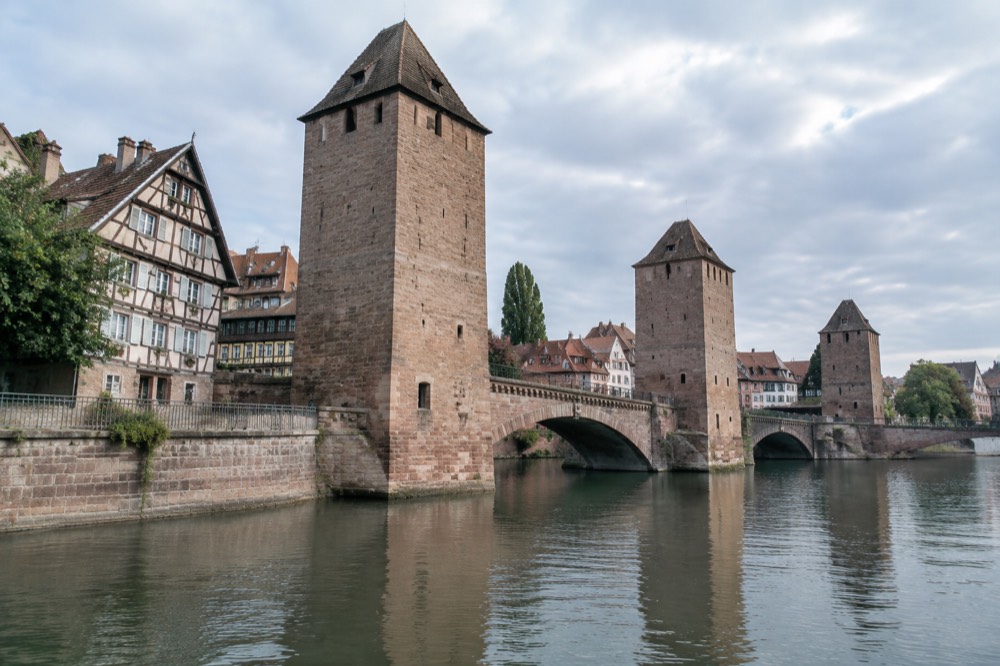 Half-timbered houses and a canal in the Petite France quarter near the covered bridges