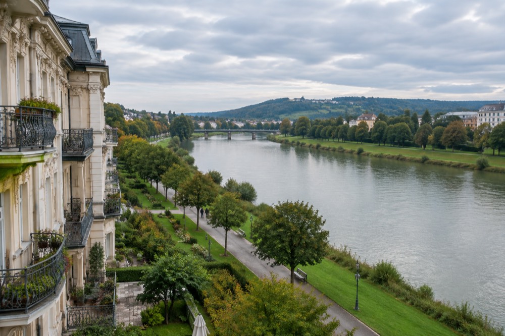 The wide Rhine river flowing between grassy banks under an open sky