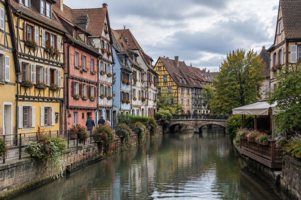 Half-timbered houses with colourful facades along a canal in Colmar old town