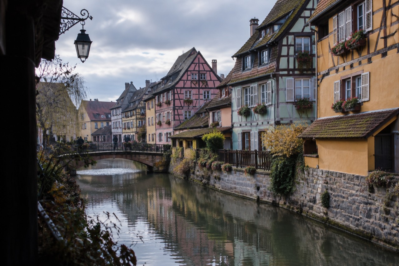 Half-timbered houses with colourful facades along a canal in Colmar old town