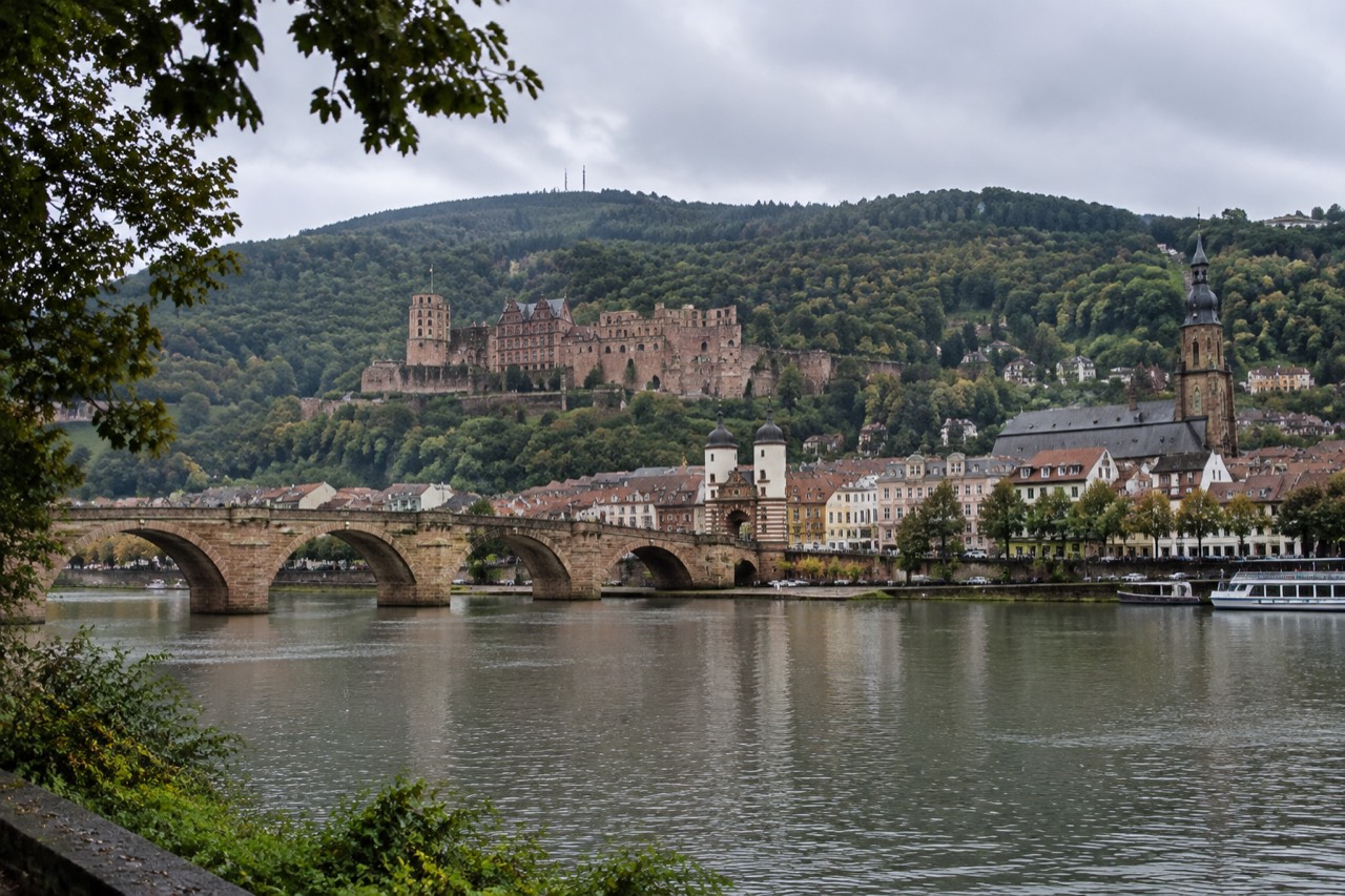 Heidelberg old town and castle ruins seen from the far bank of the River Neckar
