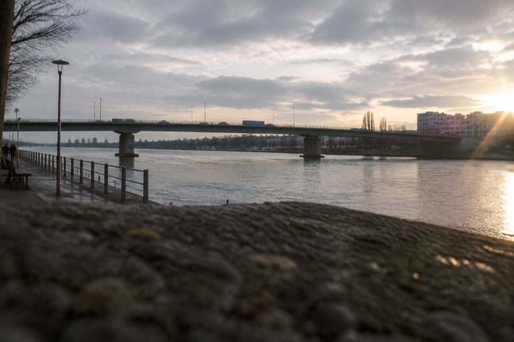 A bridge over the Rhine with traffic crossing between the two river banks