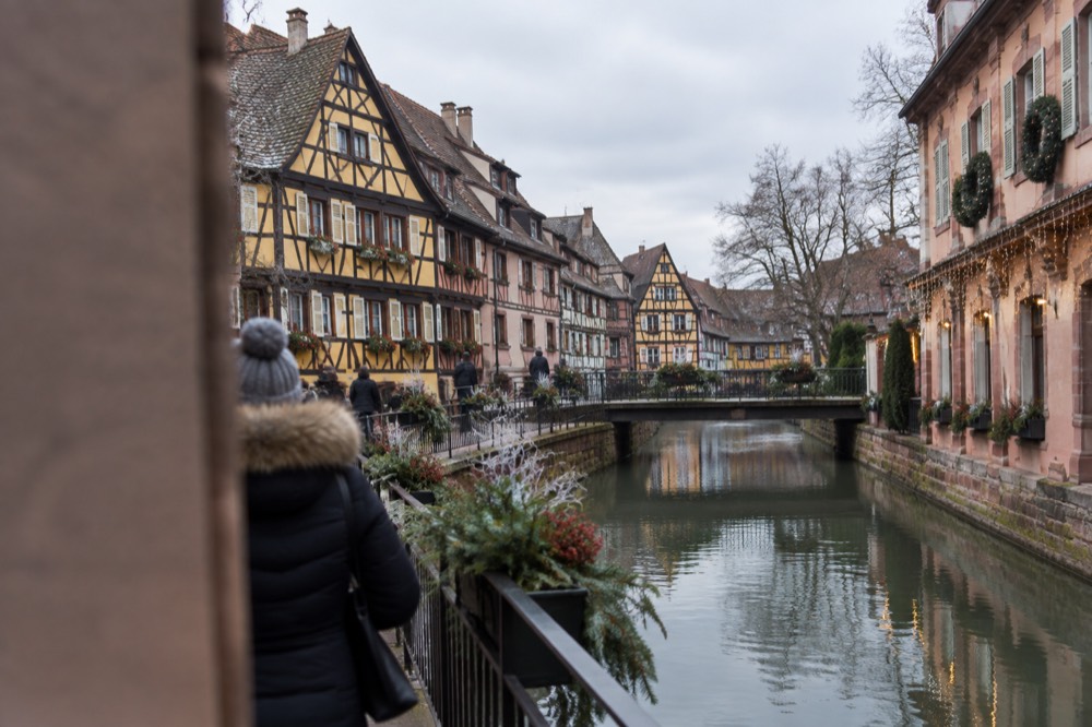 A hotel facade with wreaths and festive lights in Strasbourg's old town