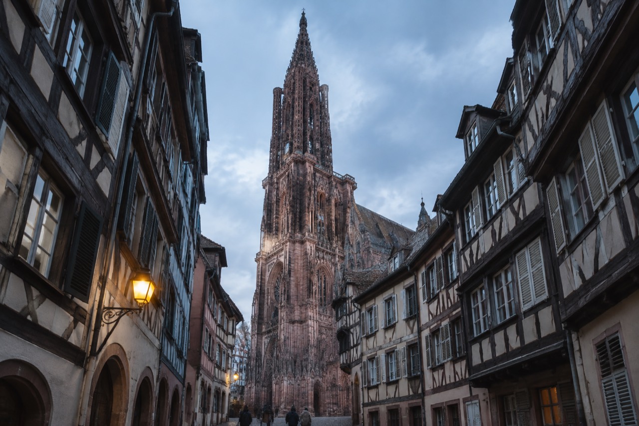 Half-timbered houses above a narrow cobbled street in central Strasbourg