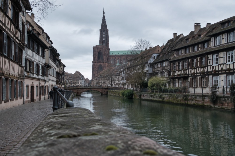 Half-timbered buildings along a quiet canal in Strasbourg city centre