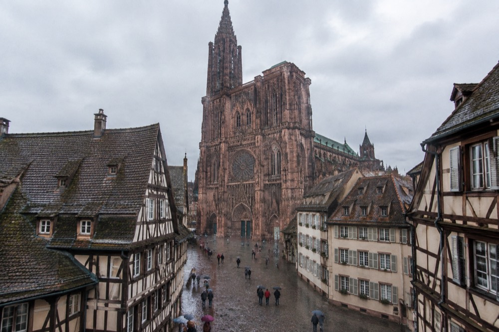 Cobblestone square with pedestrians in daylight in central Strasbourg