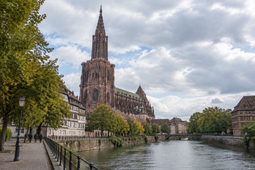 Riverside walkway with trees along the Ill in Strasbourg