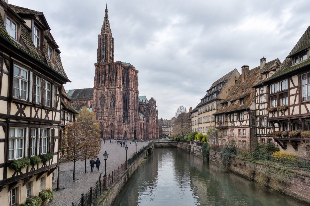 Half-timbered buildings along a quiet canal in Strasbourg city centre