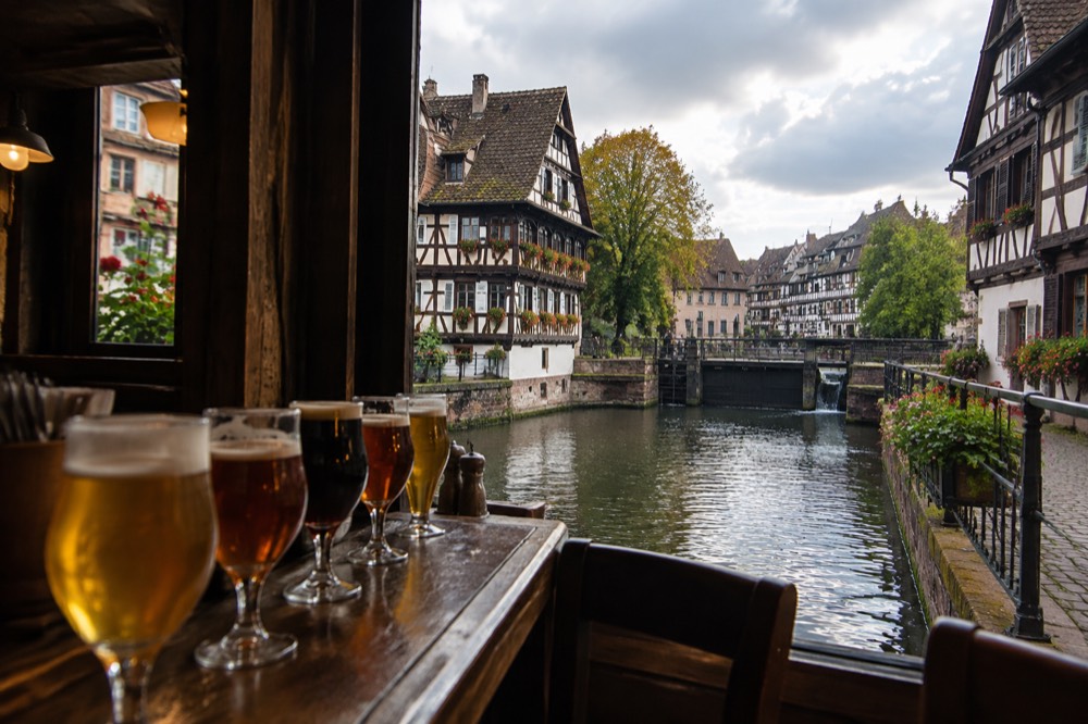 A row of beer glasses on the counter of a traditional Strasbourg winstub
