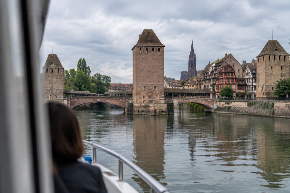 The covered bridges and the Barrage Vauban ramparts seen from a sightseeing boat on the River Ill in Strasbourg