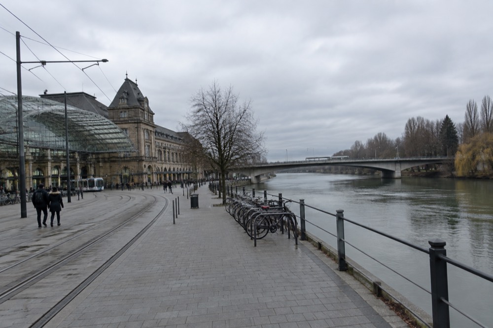 A road bridge over the Rhine with woodland on both banks