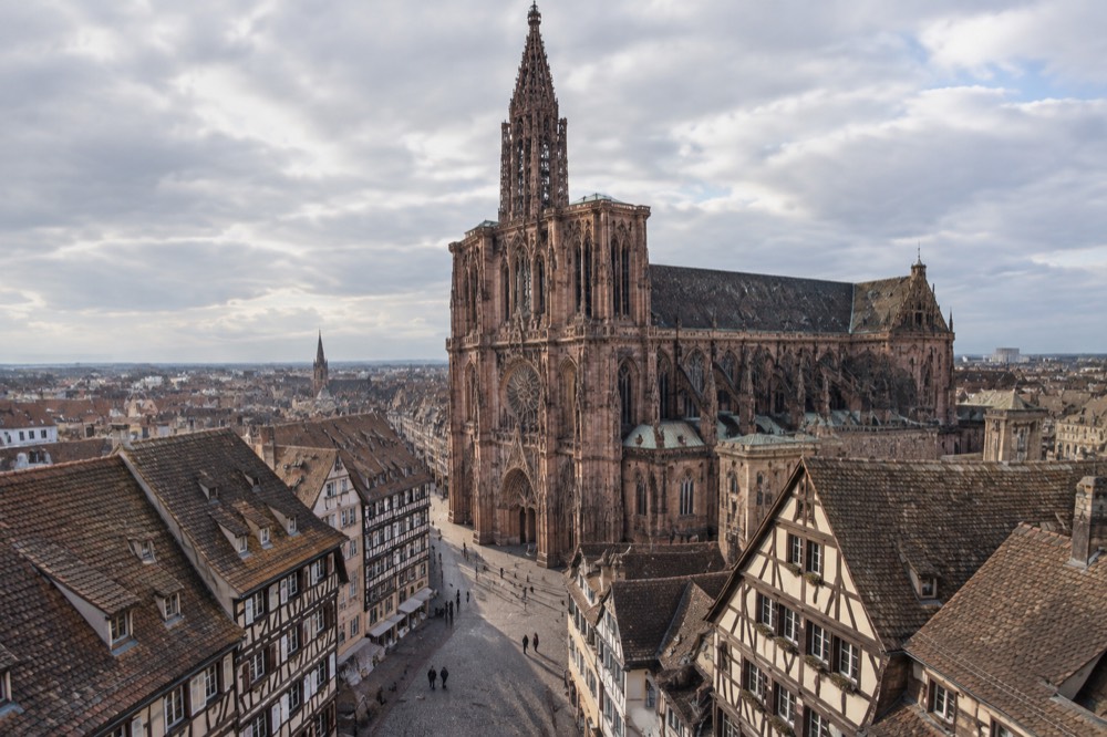 Cathedral spire rising above rooftops in Strasbourg old town