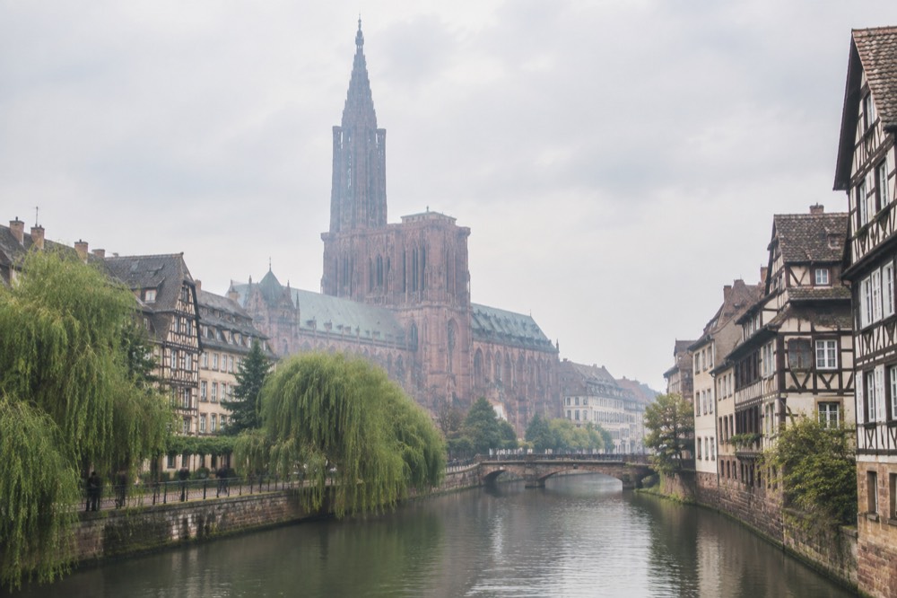 River Ill waterway with weeping willows in central Strasbourg
