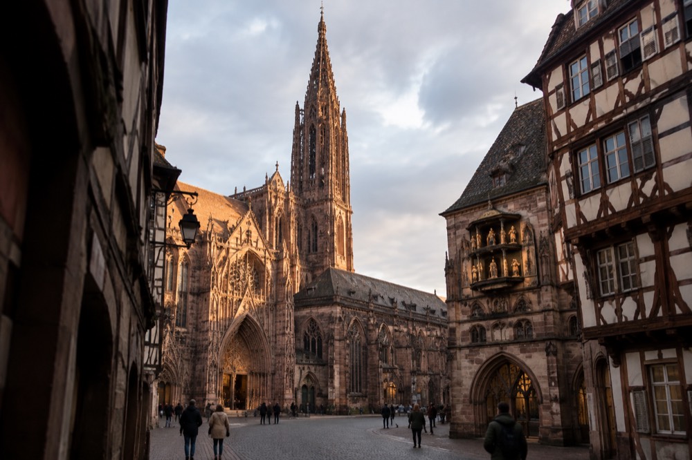 The astronomical clock's figures and the cathedral interior lit for visitors