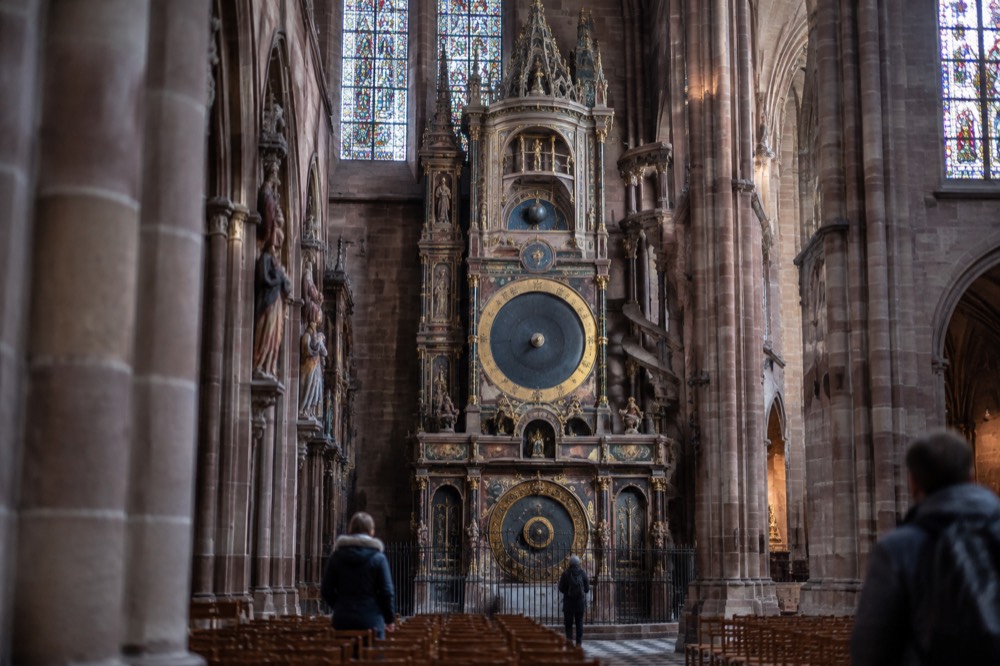 The astronomical clock inside Strasbourg Cathedral seen from the nave