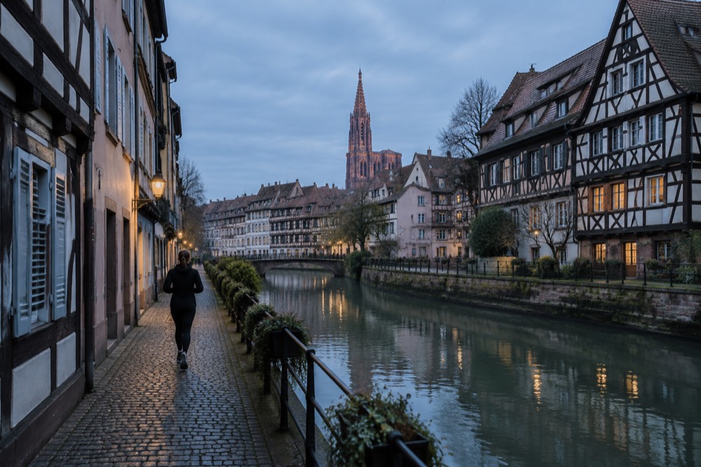 Half-timbered houses along a quiet canal in Strasbourg's Grande Île