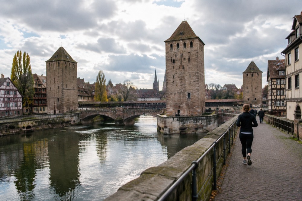The fortified Barrage Vauban and covered bridges spanning the channels of the Ill