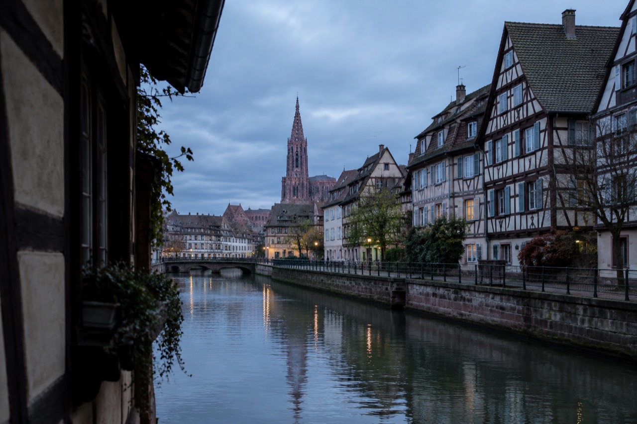 Half-timbered houses along a quiet canal in Strasbourg's Grande Île