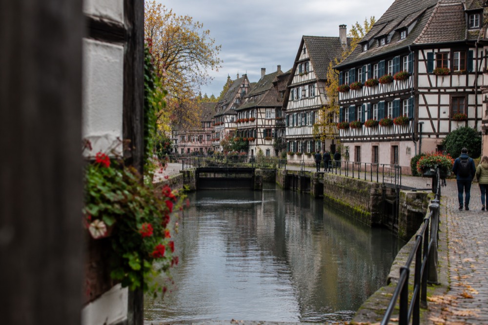 Half-timbered houses along the river Ill in Petite France under soft autumn light