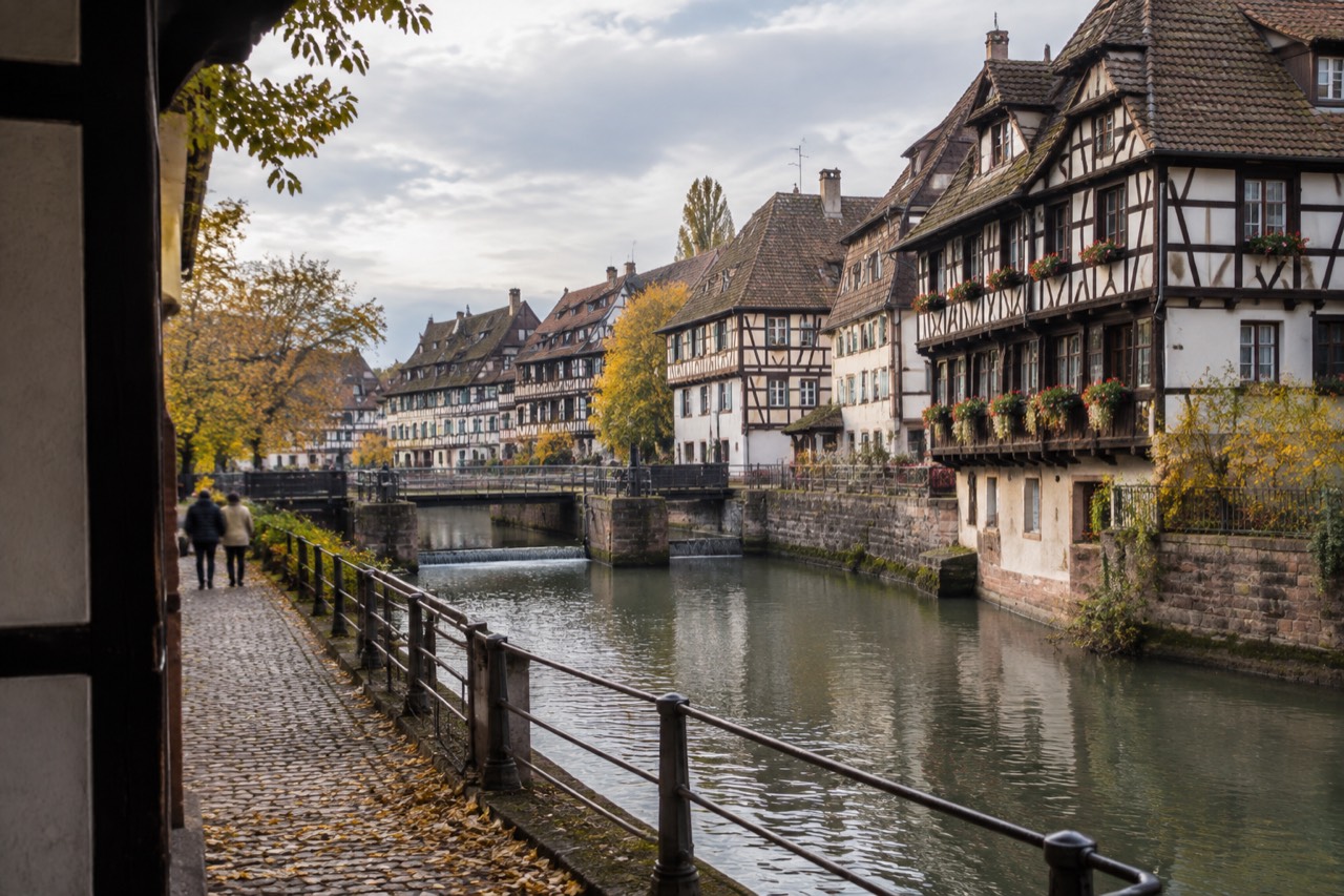 Half-timbered houses along the river Ill in Petite France under soft autumn light