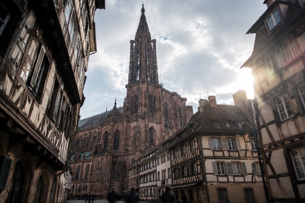 The single spire of Strasbourg Cathedral above the rooftops of the old town