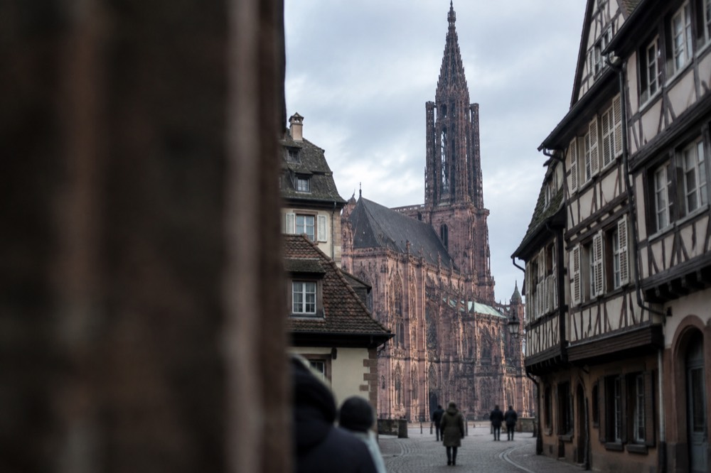Strasbourg Cathedral's single Gothic spire rising above rooftops of the old town
