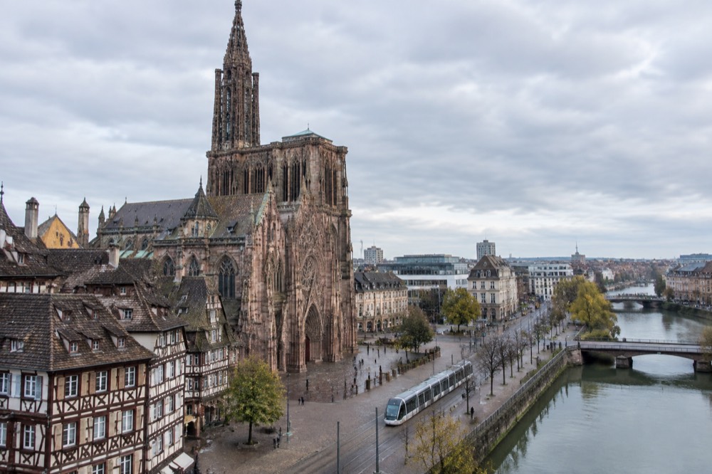 A tram passing modern buildings near Strasbourg's central station