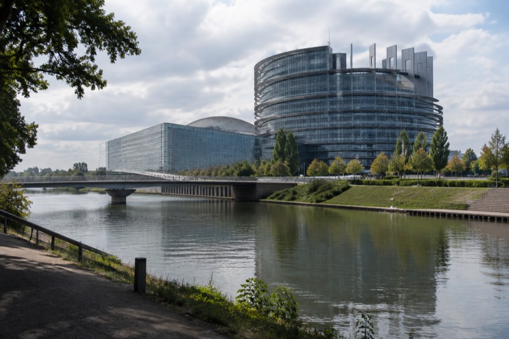 The European Parliament building seen from across the water in Strasbourg's European Quarter
