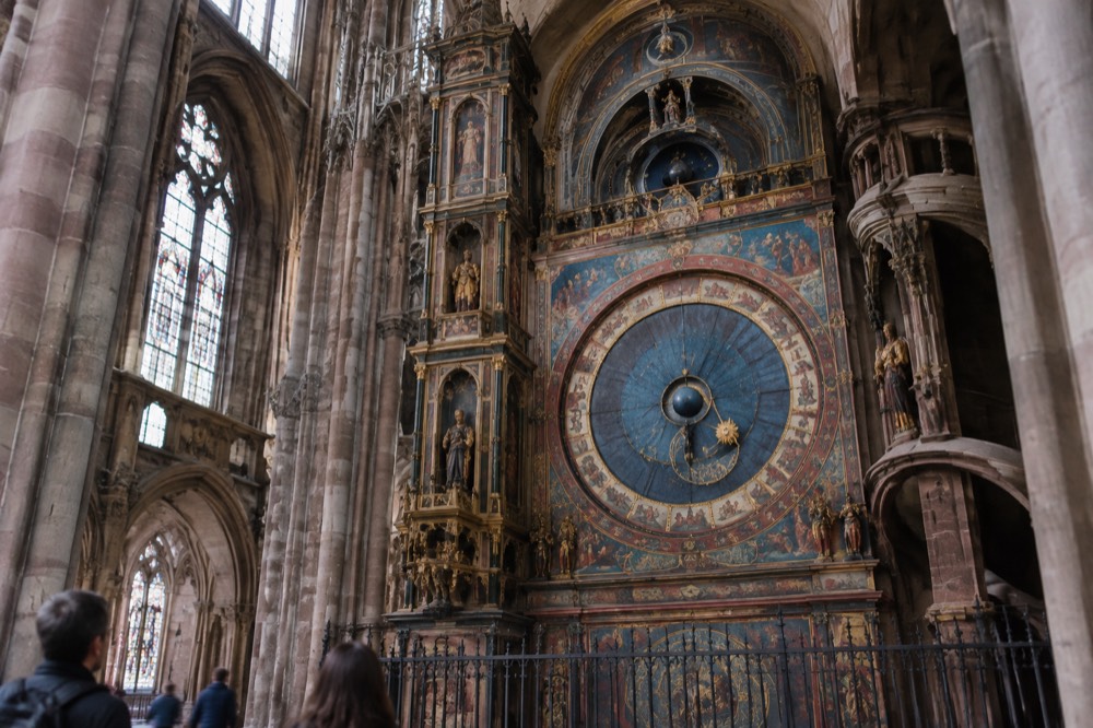 The astronomical clock's painted celestial dial inside Strasbourg Cathedral